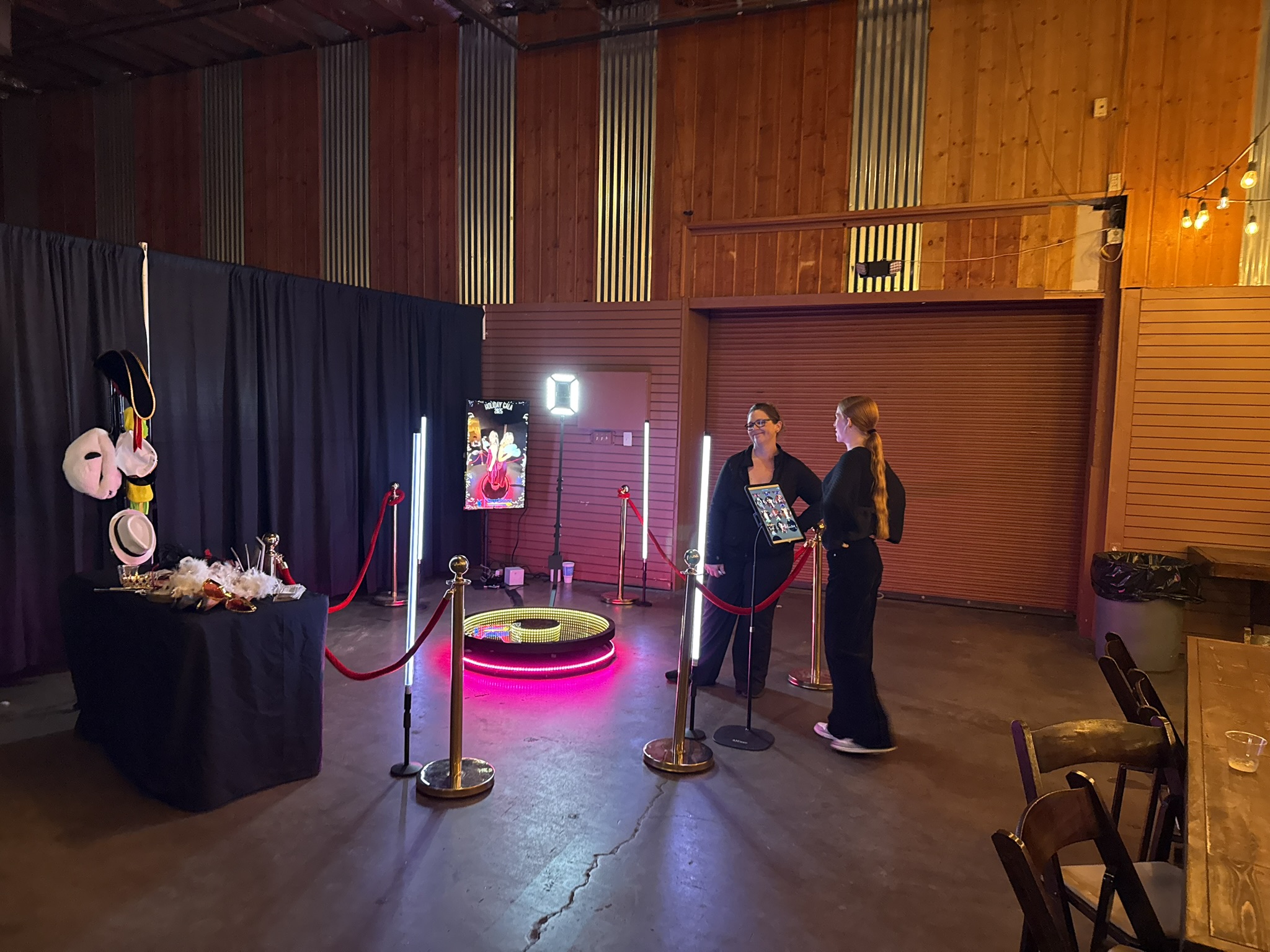 360 photo booth setup with red carpet and LED poles at Tucson venue