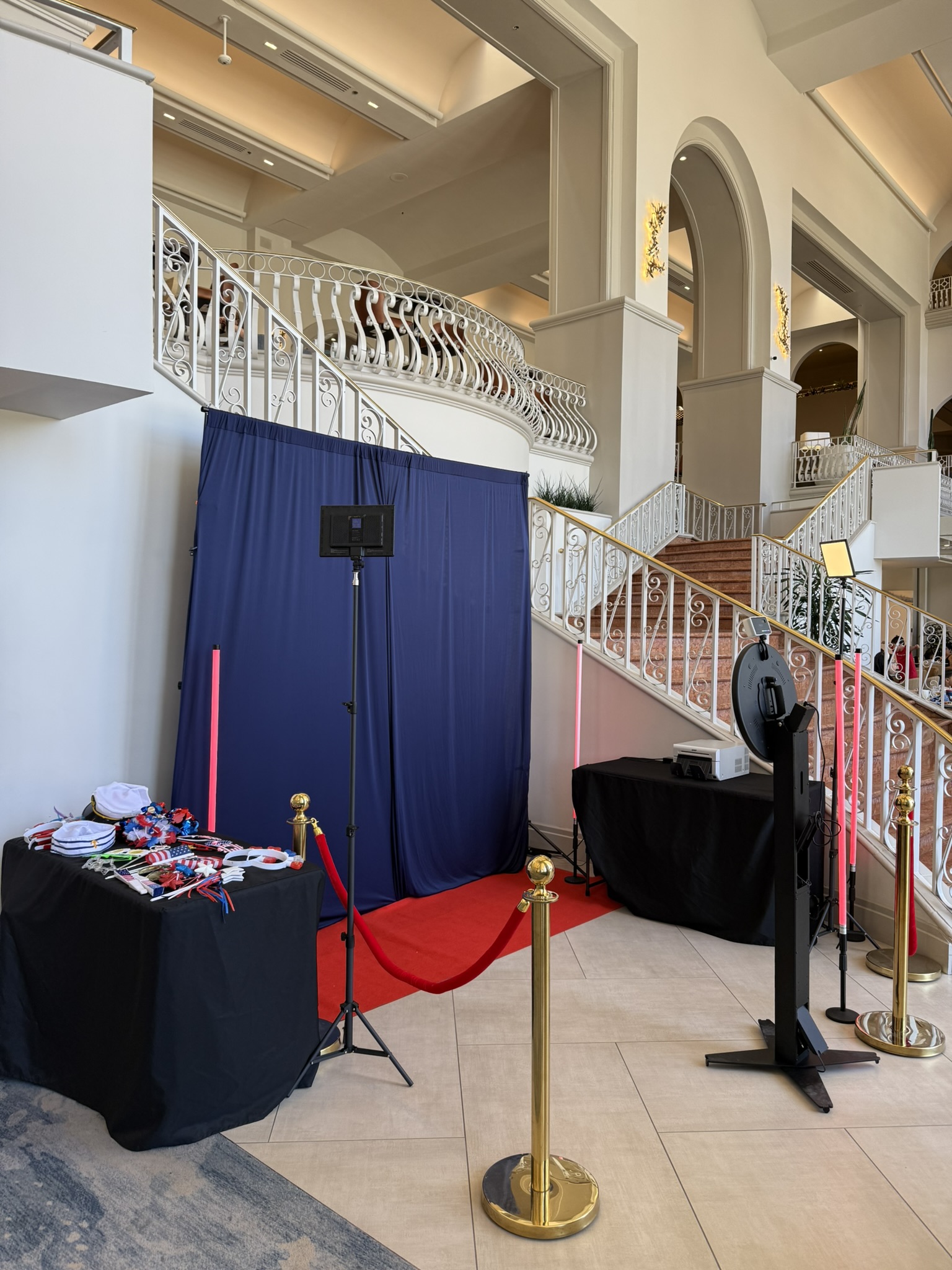 360 booth setup in grand hotel lobby with red carpet entrance