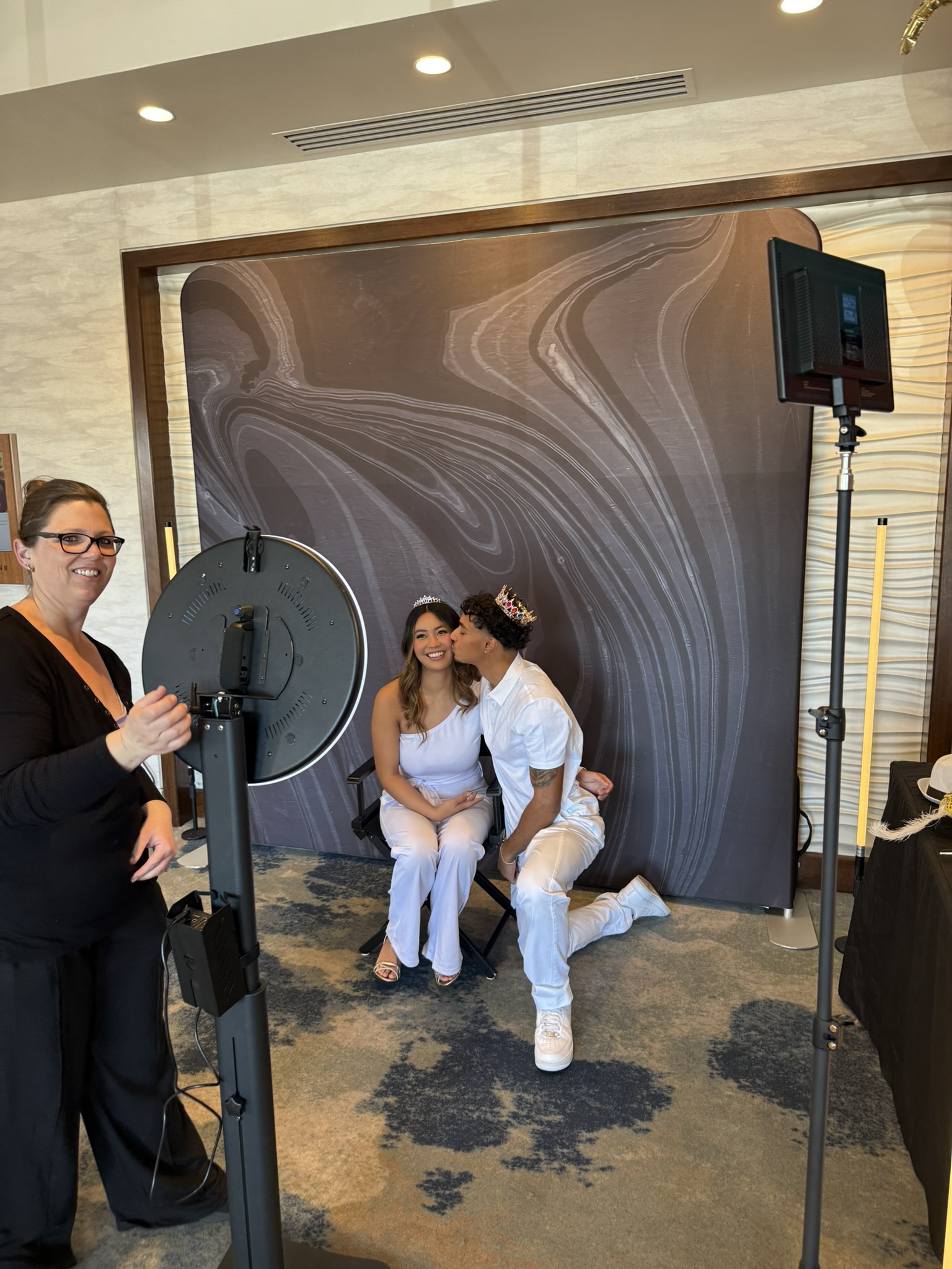 Wedding couple at photo booth with marble backdrop at Tucson hotel